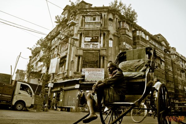 Rickshaw and old facade