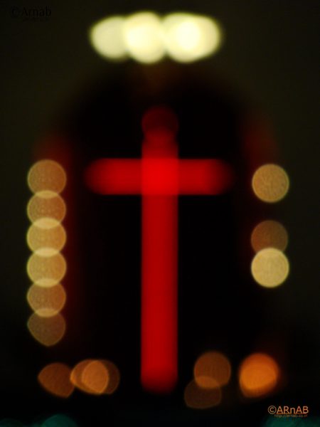 Red cross in bokeh